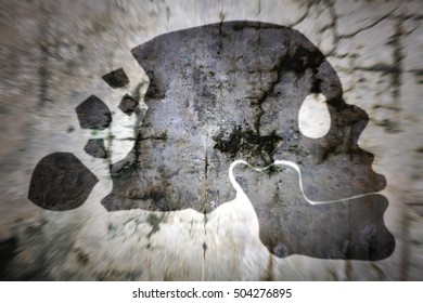 Silhouette Of A Skull With A Decaying Cranium Against A Zooming Cracking Wall For The Concept: Dementia Is A Distressing Illness.