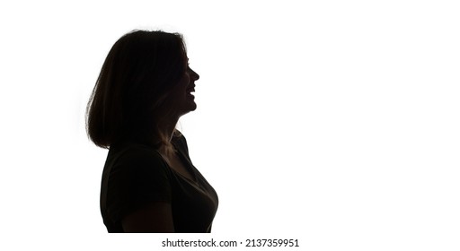 silhouette of a smiling girls profile isolated on white background - Shutterstock ID 2137359951