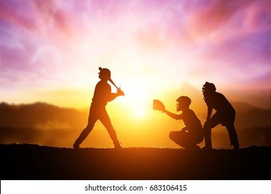 Silhouette Of Softball Player On Sunset Background