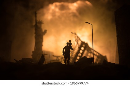 Silhouette Soldier Carrying Little Boy On His Shoulder From Fire. Rescue Savior Concept. Man Moving Out With Little Boy From Burned Out City Destroyed In War. Selective Focus