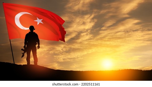 Silhouette Of Soldier With Turkey Flag On Background Of Sunset. Concept Of Crisis Of War And Political Conflicts Between Nations. Greeting Card For Turkish Armed Forces Day, Victory Day.