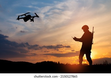 Silhouette Of Soldier Are Using Drone And Laptop Computer For Scouting During Military Operation.