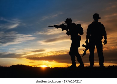 Silhouette of a soldiers against the sunrise. Concept - protection, patriotism, honor. Armed forces of Turkey, Israel, Egypt and other countries.