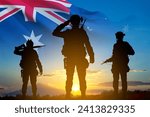 Silhouette of Soldiers with Australian flag on background of sunset. Concept - Armed Force