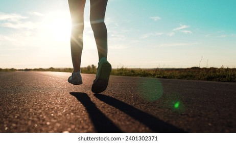 silhouette sports girl running along road sunset, legs close-up, jogging trail, joggers park, runner training, ready marathon, healthy running concept, woman running treadmill. healthy woman running