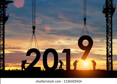 Silhouette staff works as a team to prepare to welcome the new year 2019. - Shutterstock ID 1136503424