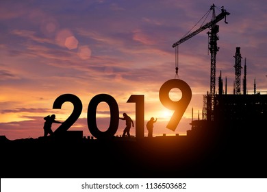Silhouette staff works as a team to prepare to welcome the new year 2019. - Shutterstock ID 1136503682
