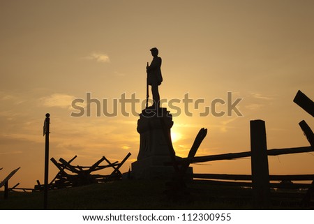 Silhouette of a statue in honor of the 130th Pennsylvania Volunteer Infantry at Bloody Lane in the Antietam (Sharpsburg) National Battlefield, Maryland, USA