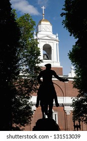 Silhouette of the statue of Paul Revere in front of Historic Old North Church, James Rego Square, North End, Boston, MA