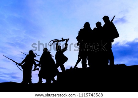 Silhouette of Statue soldiers marching to war at the Monument to the Heroic Defenders of Leningrad