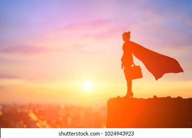 silhouette of super business woman look somewhere on the mountain - Shutterstock ID 1024943923