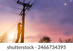 Silhouette technician engineer work on high electronic pole computer graphic light, running fiber optic cable or maintenance cable connector, high voltage electricity repair , copy space for text