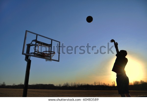 Silhouette Teen Boy Shooting Basketball Sunset Stock Photo (Edit Now) 60483589