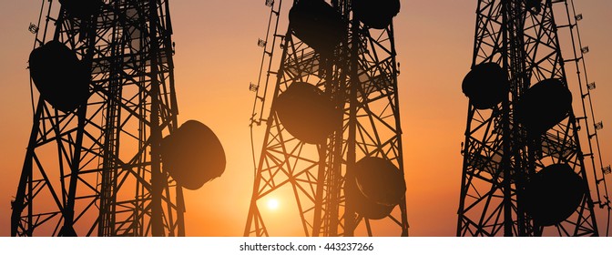 Silhouette, telecommunication towers with TV antennas and satellite dish in sunset, panorama composition - Shutterstock ID 443237266