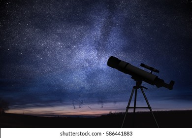 Silhouette of telescope and starry night sky in background. Astronomy and stars observing concept.