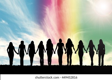 Silhouette of ten young women, walking hand in hand under a rainbow sky.