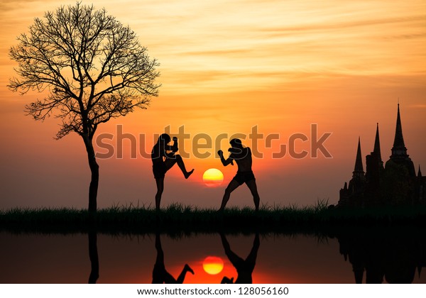 Silhouette of a thai\'s\
boxing at sunset