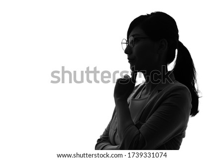 Silhouette of thinking asian woman.