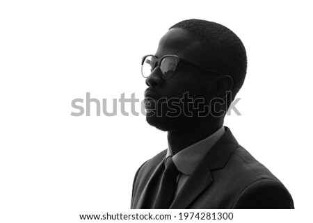 Silhouette of thinking black businessman.
