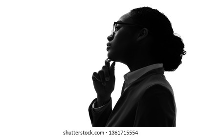 Silhouette of a thinking black woman.