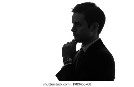 Silhouette of thinking young businessman.  - Shutterstock ID 1983455708