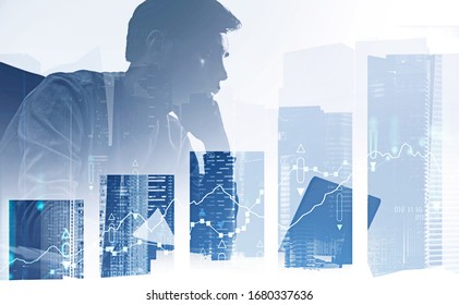 Silhouette of thoughtful young investor with notebook in abstract city with double exposure of blurry digital graph and big bar chart. Concept of investment, forex and stock market. Toned image - Powered by Shutterstock