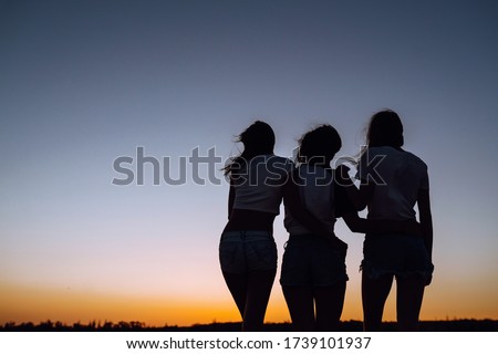 Image, Stock Photo Three women standing on urban stairs at night ready for an evening exercise session in the city