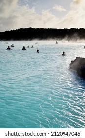 Silhouette of tourists enjoying the afternoon in the famous Blue Lagoon of southwestern Iceland - Shutterstock ID 2120947046