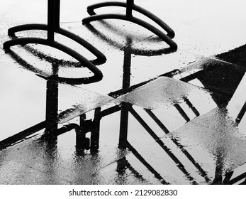 silhouette of traffic barrier on wet floor after rain, black and white style