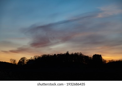 Silhouette Of Treeline And Sunset. Shot At Dusk In Early Spring In Sweden, Scandinavia.