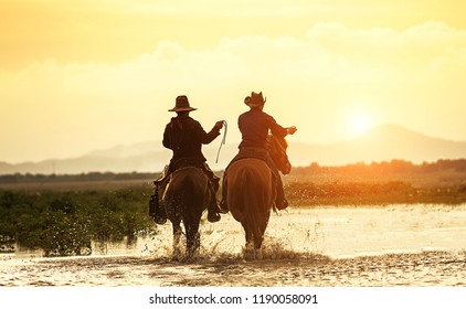  Silhouette Two Cowboy On Horseback. Ranch