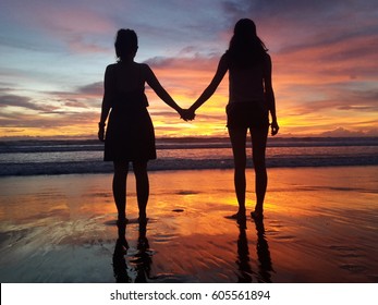 2 friends holding hands