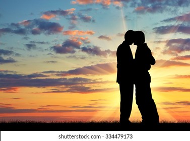 Silhouette Of Two Gay Men Kissing At Sunset