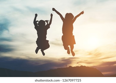 Silhouette of two girl having fun in nature - Shutterstock ID 1267097725