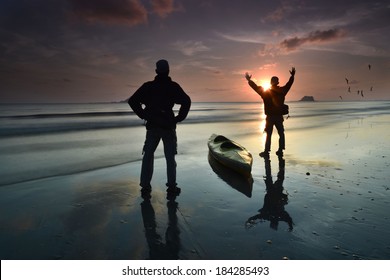 A Silhouette A Two Man With Kayak Enjoy A Sunrise Near At Beach, Awesome Reflection