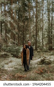 Silhouette Of Two Persons Man And Woman Walking Among Huge Trees In Forest Small People Big Nature Concept Light Mystical Spooky Ferry Tale Mood Looking In Different Directions Different Aims