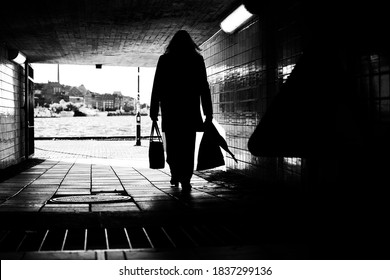 Silhouette Of Unrecognizable Business Woman Exiting The Subway.