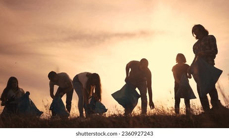 silhouette volunteers collect plastic. group team people collect plastic bottles together. environmental protection business concept. volunteers family lifestyle collect plastic clean nature - Shutterstock ID 2360927243