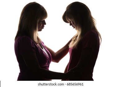 Silhouette Of Warm Friendly Relations Between Mother And Daughter Teenager Who Has Problems In Her Personal Life And Mother Lovingly Consoles, Pities And Strokes The Child On White Isolated Background