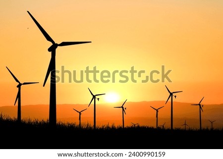 silhouette of wind turbine generating electricity, clean energy concept, alternative energy, wind energy