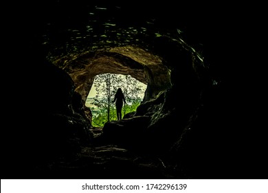 Silhouette Of A Woman In A Cave