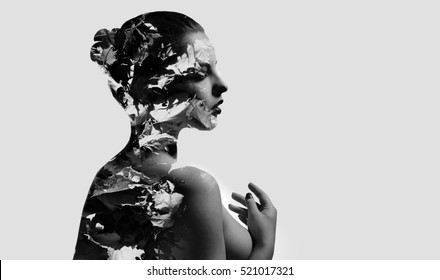 Silhouette of a woman combined with a autumn maple leaves. Double exposure, isolated on a white background. Black and white