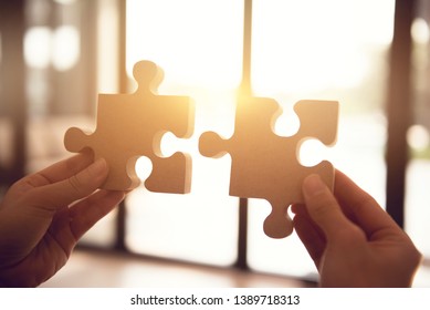 Silhouette Of Woman Connecting Jigsaw Puzzle With Sunlight Effect, Business Solutions, Success And Strategy Concept.