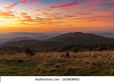 Silhouette Of Woman And Dog Watching The Sunset From Max Patch Bald Over The Great Smoky Mountains