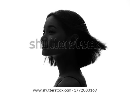 Silhouette of woman head shot. Hair care.