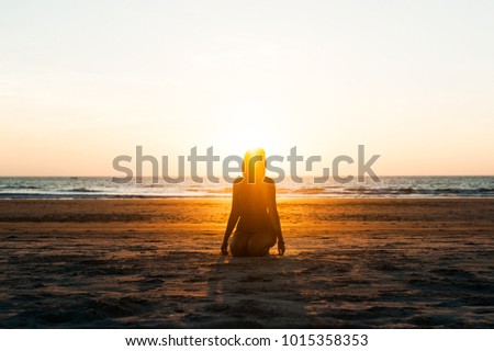 woman beach sunset horizon