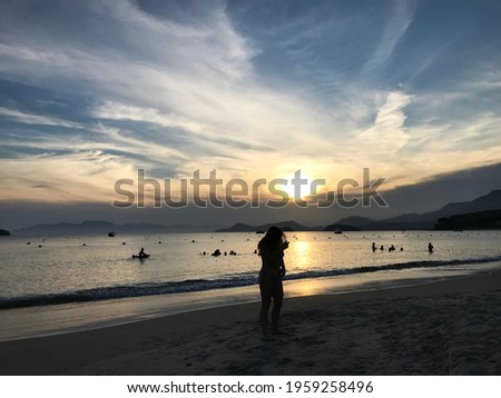 silhouette of a woman on Tabatinga beach, São Paulo. Sunset background