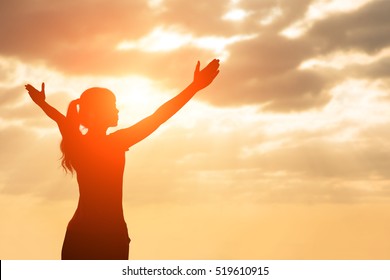 silhouette of woman pray with sunlight