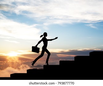 Silhouette of woman rise up on stairs from business word.