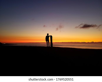 Silhouette Of Woman Sandboarding In Iquique, Chile.